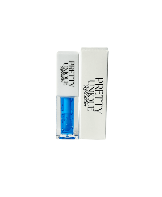 Blueberry Xclusive Lip Plumper Oil in clear tube with blue gloss and Pretty Unique Collection packaging. Hydrating lip makeup for fuller, glossy lips.